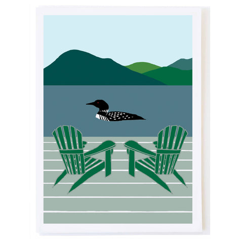 Loon Swimming by Dock